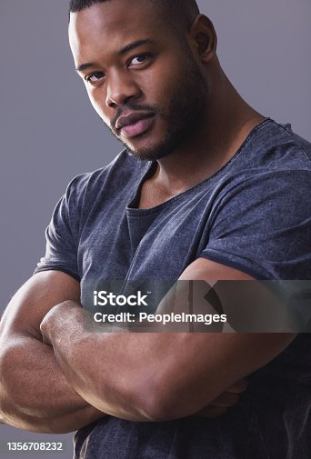 istock Studio shot of a handsome young man posing against a grey background 1356708232