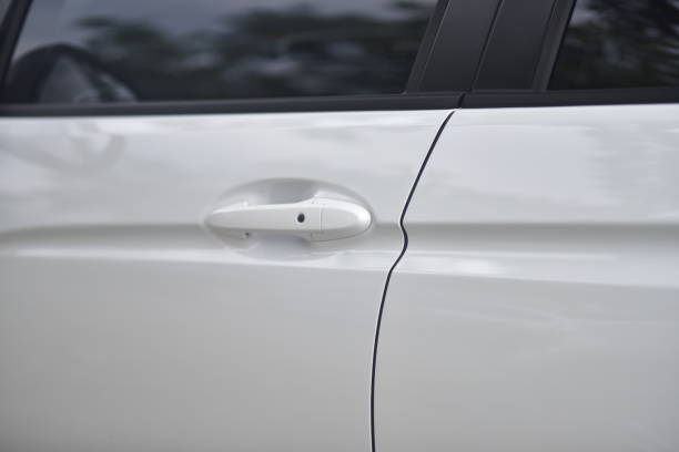 istock close up of white car door handle 1356710326