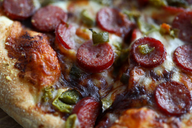 Fresh baked pizza with crusty cheese and hot tasty pepperoni