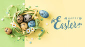 Happy Easter card with quail Easter eggs.