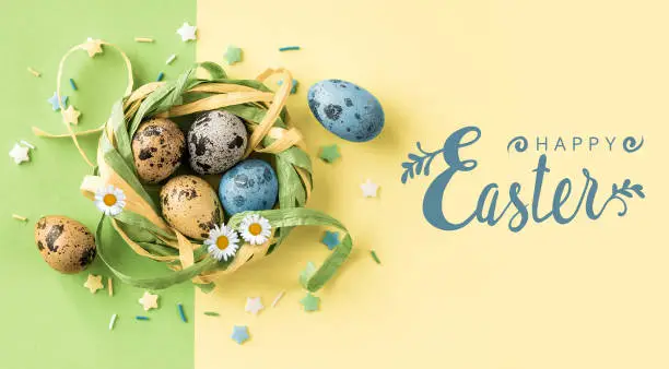 Photo of Happy Easter card with quail Easter eggs.