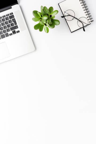 istock Minimalist office desktop with laptop and accessories. Business background with copyspace 1356716371