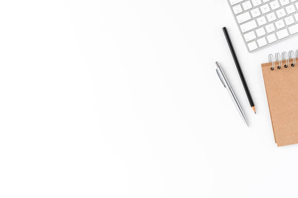 Elegant business workspace with keyboard, notebook and pen. Office desktop concept