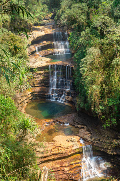 istock natural waterfall layered falling from mountain top in deep green forests at morning from top angle 1356717233