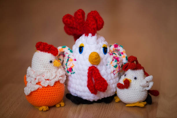 istock Knitted cock, isolate. Textile decoration for interior design or Christmas tree. Perfect for a gift. 1356719402