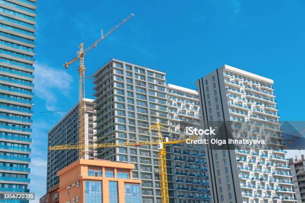 Construction Of Buildings In The City Of Batumi New Boulevard Construction Crane Multistorey Buildings Hotels Construction Site On A Sunny Bright Day Against The Blue Sky Stock Photo - Download Image Now