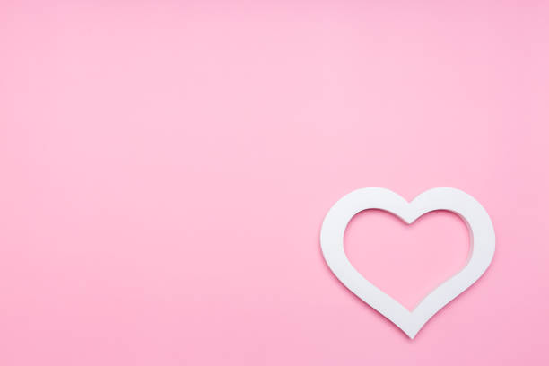 istock white heart on a pink background with room for text 1356720590