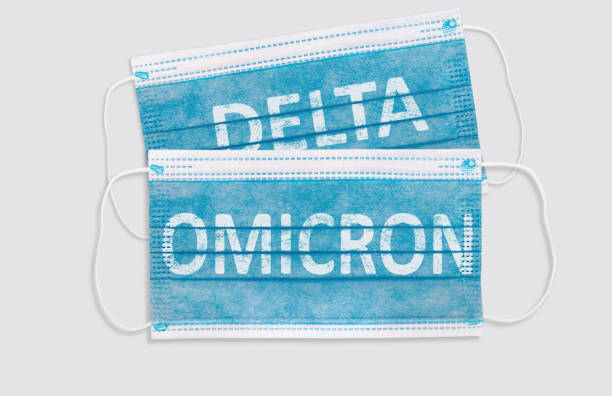 istock Face masks with inscriptions Omicron . Covid 19 alpha, beta, gamma, delta, lambda, mu, omicron variants outbreak around the world 1356722308