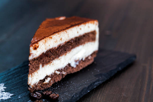 istock chocolate cake with cream layers, close up 1356723655