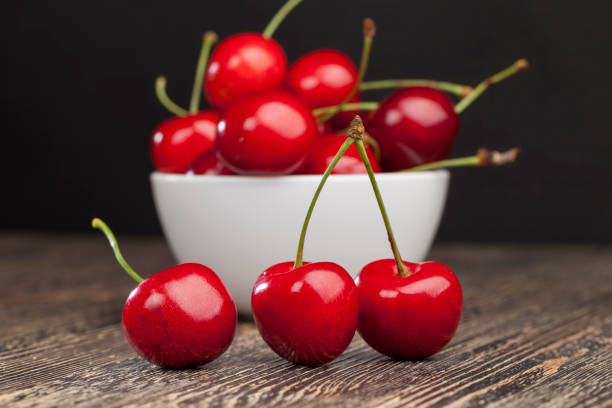 istock red ripe sweet cherries on a wooden table 1356723732