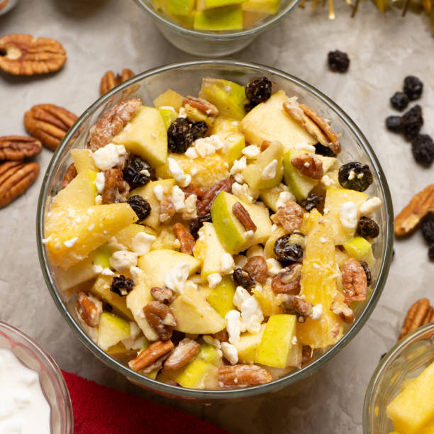 istock Apple salad with walnuts for Christmas on a gray background 1356726141