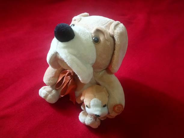 istock plush dog with its puppy - white and brown 1356727845
