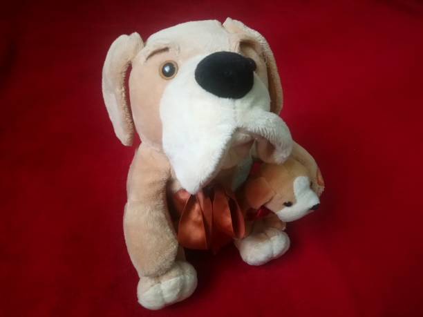 istock plush dog with its puppy - white and brown 1356727901