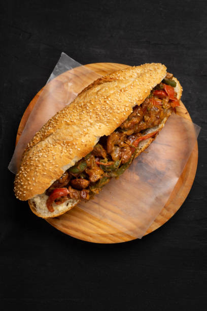 istock Philly cheese steak with bell pepper on dark background 1356728883