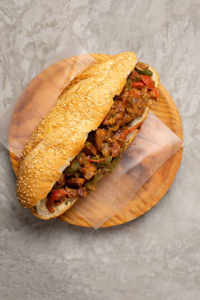 istock Philly cheese steak with bell pepper on gray background 1356729060