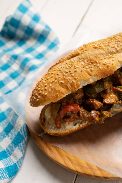 istock Philly cheese steak with bell pepper on white background 1356730308