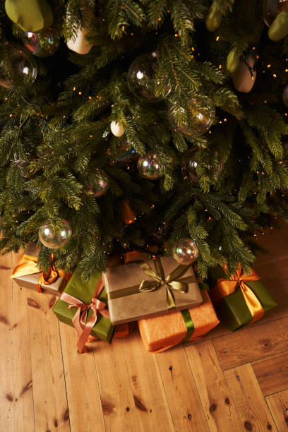 istock christmas gifts in beautiful boxes under the christmas tree 1356730814