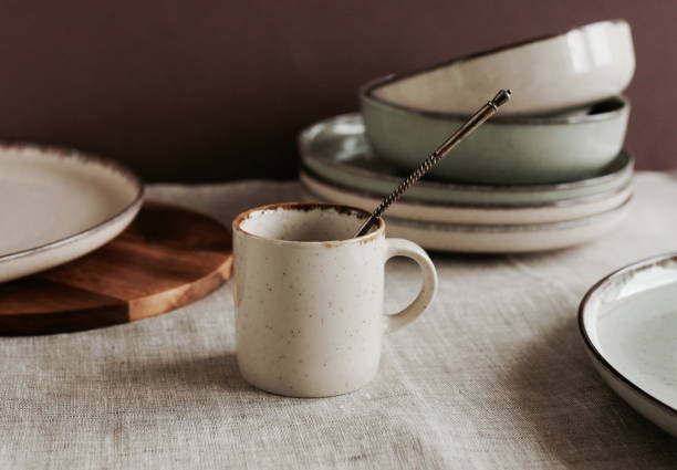 istock Coffee mug mockup on the beige linen tablecloth in the modern kitchen interior . copy space. 1356731211