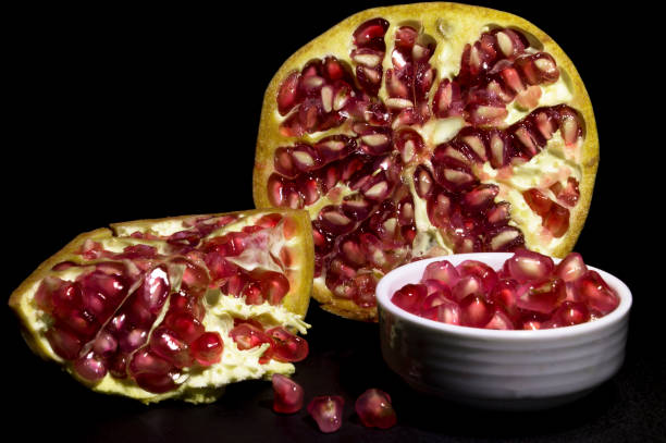 istock pomegranate with seeds on a plate 1356733966