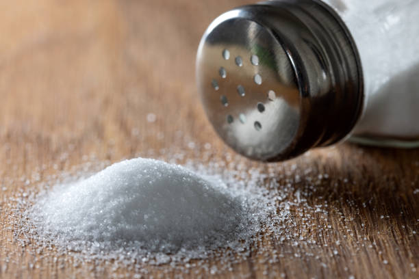 istock Pile of salt and one salt shaker 1356737210
