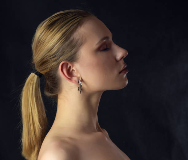 istock Woman with smoky eyes makeup. 1356738280