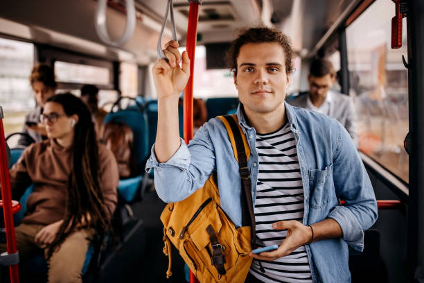 istock Young hipster man posing in public bus 1356741414