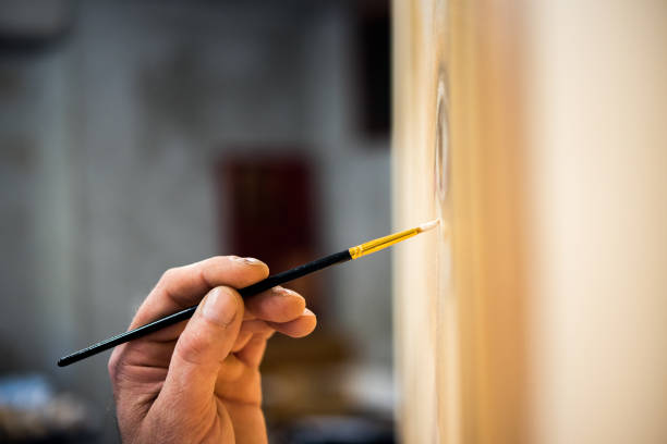 istock Artist Hand Painting on Canvas 1356742743