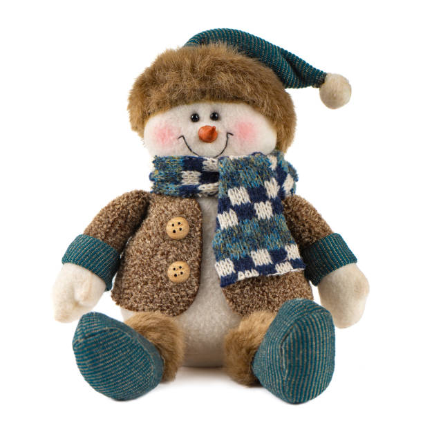 istock Handmade snowman toy dressed in knitted cap with gift box isolated on white background 1356743357
