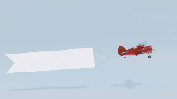 istock Airplane towing white blank banner for text 1356743453