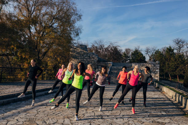 istock Smiling and motivated group of women do warm-ups before training. 1356743526
