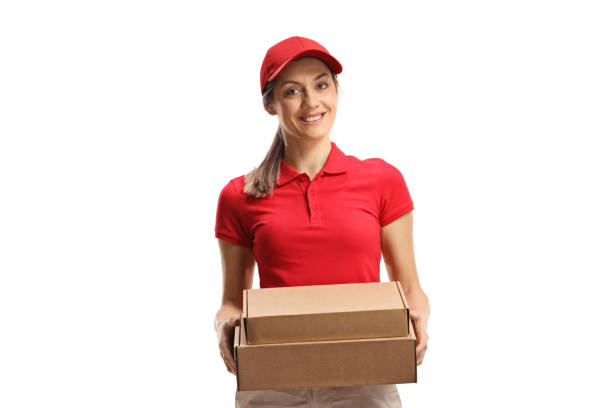 istock Delivery woman holding packages and smiling 1356744568
