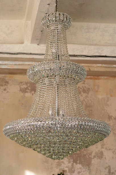 istock Large antique crystal chandelier in loft style interior. Soft side-by-side focus. 1356747435