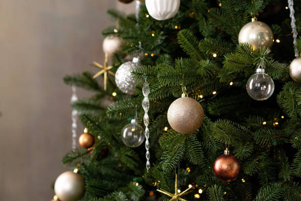 istock New year background. Christmas tree and Christmas lights and decorations. Soft selective focus. 1356748165