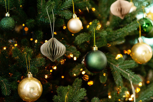 istock New year background. Christmas tree and Christmas lights and decorations. Soft selective focus. 1356748172