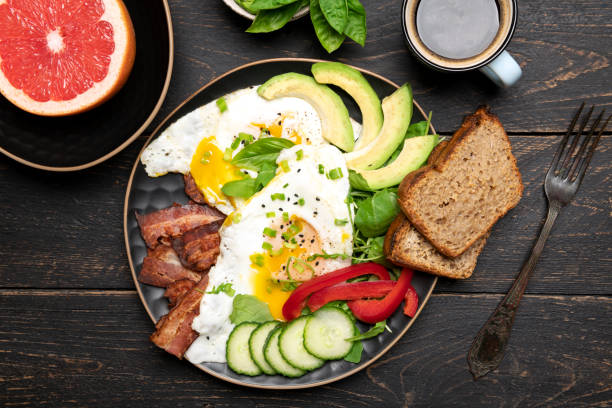 istock Fried eggs sunny side up on baguette, bacon and arugula 1356748258