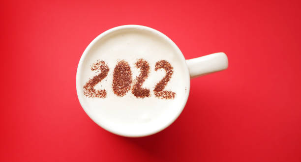 istock 2022 numbers in cup of coffee. Top view 1356748581