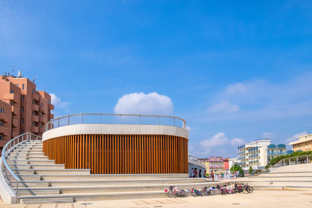 Young people enjoy at the Belvedere of Piazzale Kennedy on the seafront promenade of Rimini, ​one of the main destinations of summer tourism on the Adriatic riviera of Romagna.