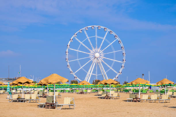 Rimini, Beach & Ferris Wheel (Emilia-Romagna, Italy) Beach of Rimini with the ferris wheel in background rimini stock pictures, royalty-free photos & images