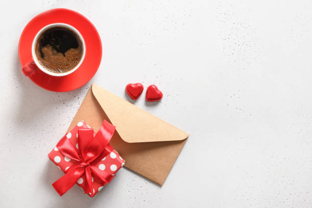 istock Valentine's day romantic coffee, love letter, gift, chocolate sweets on white. 1356750082
