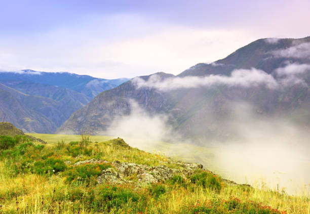 istock Morning clouds in the Altai mountains 1356754087