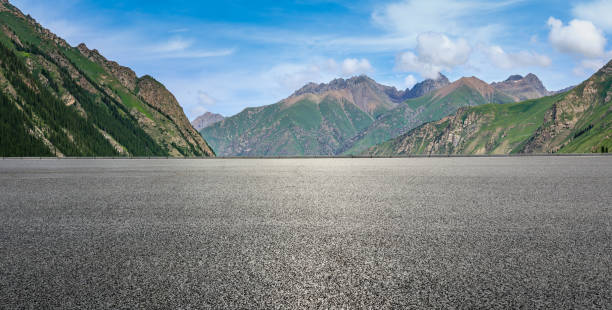 istock Empty asphalt road and mountain under blue sky 1356755382