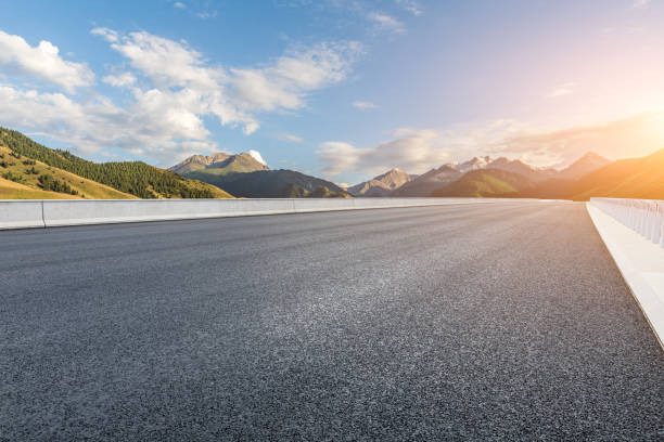 istock Asphalt road and mountain scenery at sunrise 1356755631