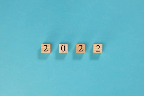istock 2022 year on wooden blocks on  blue background 1356757201