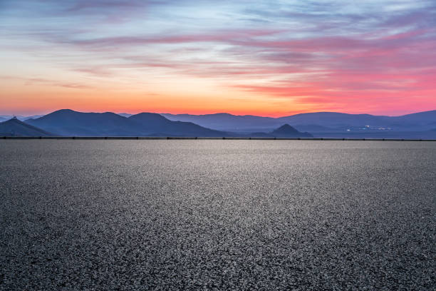 istock Asphalt road and mountain scenery at sunrise 1356757390