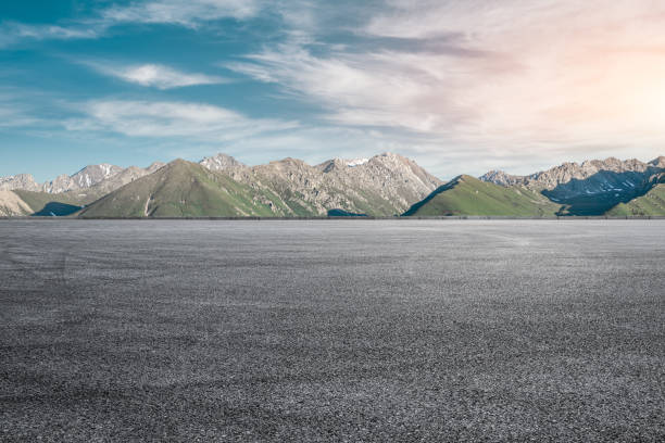 istock Asphalt road and mountain under blue sky 1356757487
