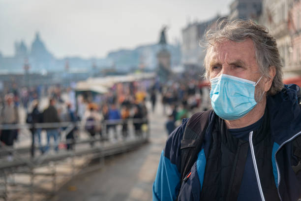istock Senior Man with Protective mask Visiting Venice during Pandemic, Italy 1356758342