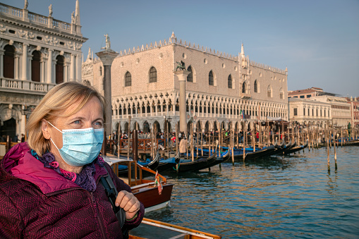 Senior Woman with Protective mask Visiting Venice during Pandemic, Italy
