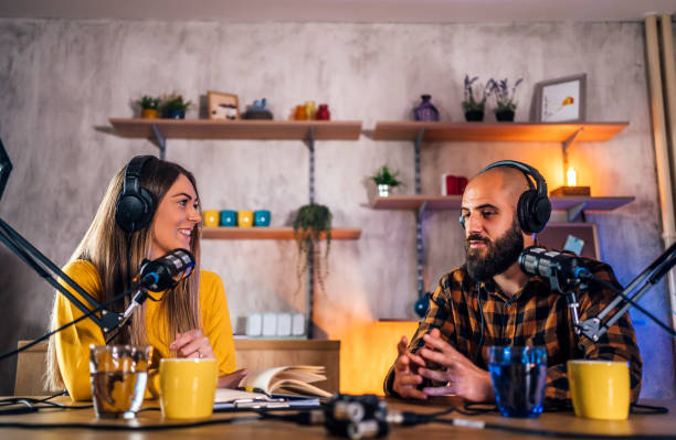 istock Two young people recording a podcast 1356758955