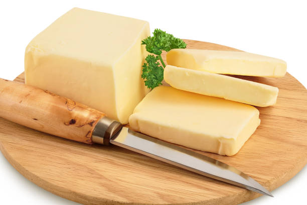 istock butter slices on wooden board isolated on white background with clipping path and full depth of field 1356759971