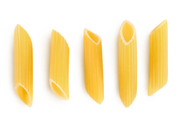 istock Raw italian penne rigate pasta isolated on white background with clipping path and full depth of field. Top view. Flat lay. Set or collection 1356760007